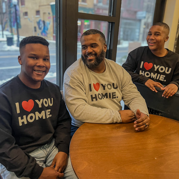 Father and son matching in sweatshirts for valentines day