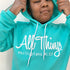 teen wearing inspring hoodie in teal color that is referencing scripture in the bible Philippians 4:13 I can do all things through christ who strengthens me.