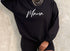 black pullover sweatshirt with design screen print script font that says mama