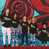 mother and children behind a grafitti art wall background in family matching shirts the original the remix, the encore, mic drop, a fresh new beat