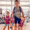 dad matching with three of his daughters wearing an olive shirt by dad that says man of a castle full of princess hashtag girl dad and girls wearing maroon shirts that says princess cute matching shirt set for girl dads
