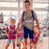 dad matching with three of his daughters wearing an olive shirt by dad that says man of a castle full of princess hashtag girl dad and girls wearing maroon shirts that says princess cute matching shirt set for girl dads